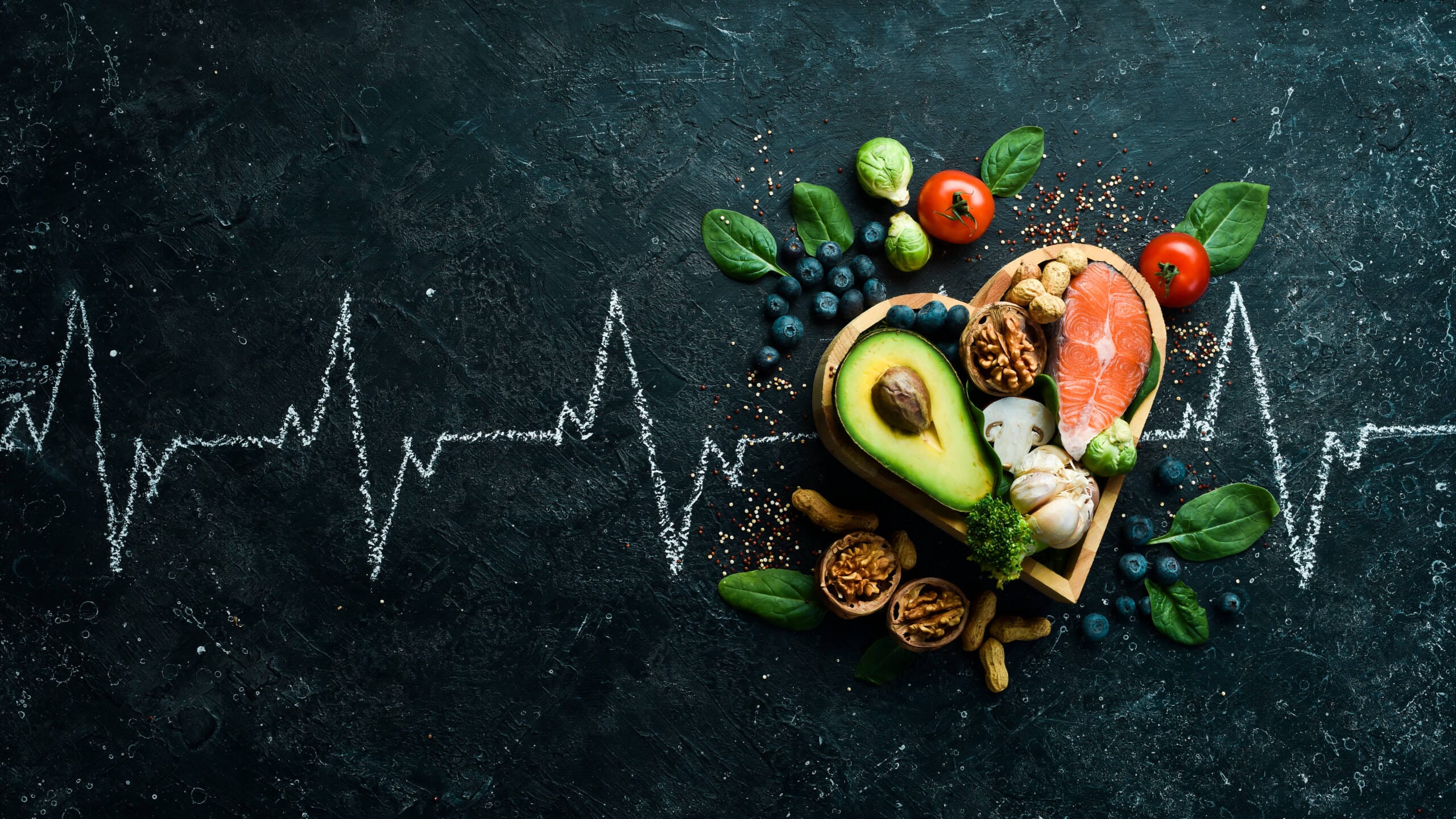 food banner healthy foods low carbohydrates food heart health salmon avocados blueberries broccoli nuts mushrooms black stone background top view 1 scaled